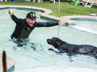 Cesar Milan showing how to train your dog in the pool