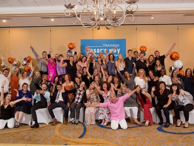 A group photo of the graduation party of the Training Cesar's way class