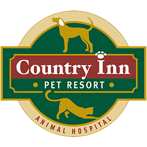 Country Inn Pet Resort and Animal Hospital logo Country Inn Pet Resort and Animal Hospital logo featuring a gold dog and cat on a green and burgundy crest with a paw print